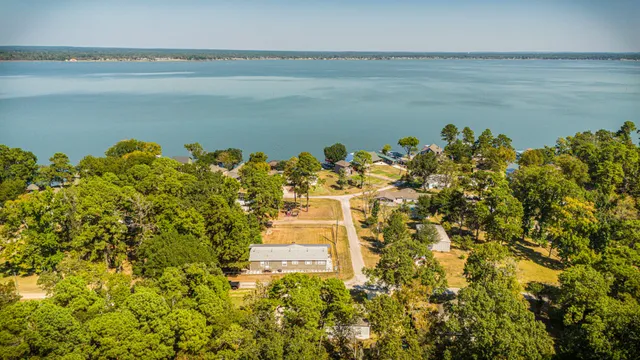 a view of a lake with a building in the background