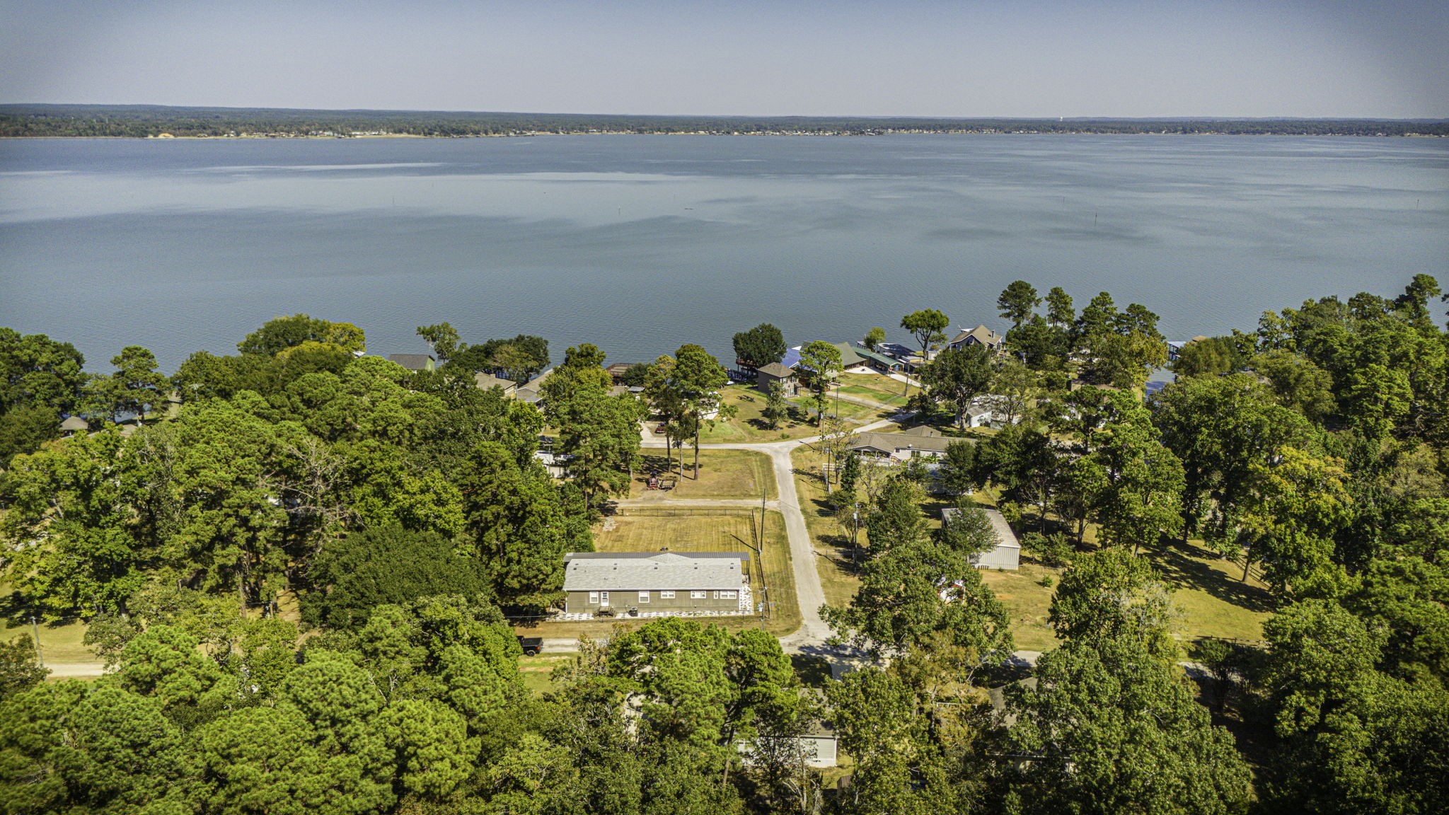 41 Ferguson Way Point Blank, TX 77364 - Photo 32 of 34 a view of a lake with a lake