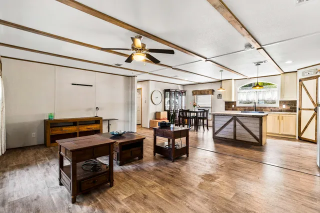 a living room with furniture and a window