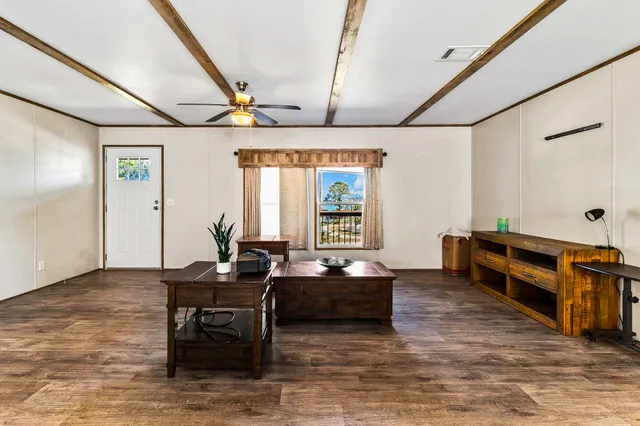 an empty room with a empty space and windows