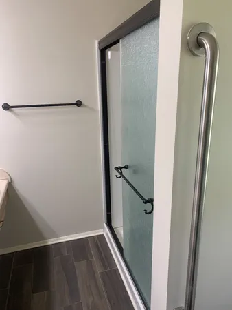 a view of a house with a yard and tree