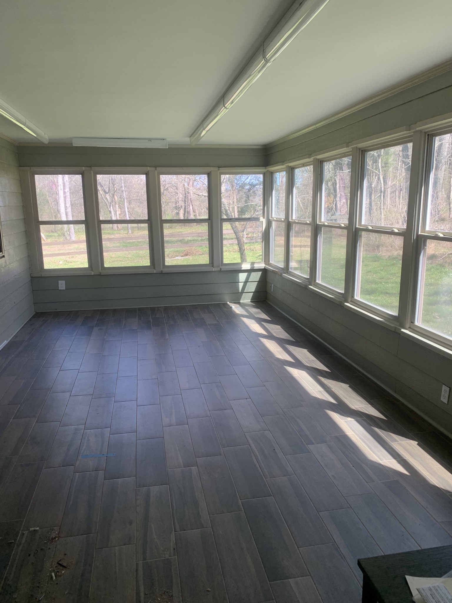 146 Cheatham Road Ardmore, TN 38449 - Photo 15 of 53 a view of an empty room with wooden floor and a window