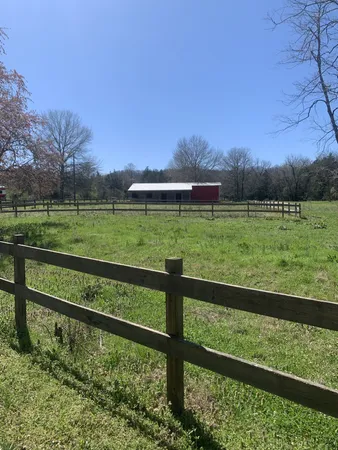 a view of a house with a small yard