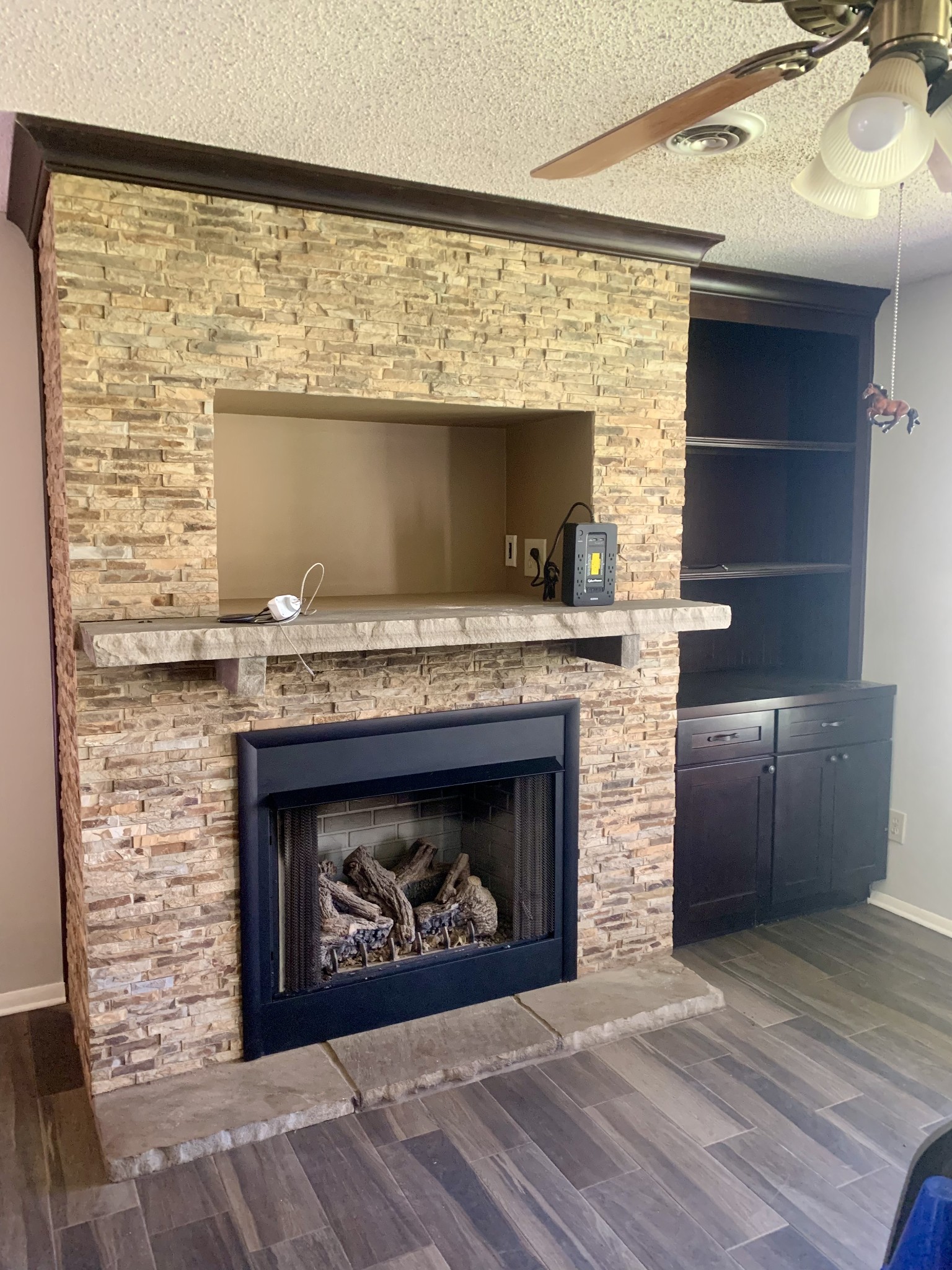 146 Cheatham Road Ardmore, TN 38449 - Photo 7 of 53 a living room with a fireplace and a wooden floor