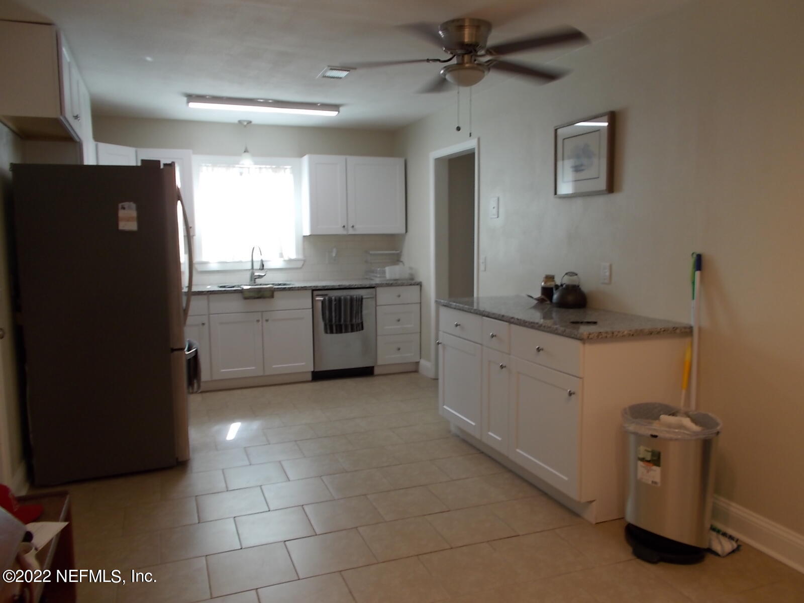 6821 Heidi Road Jacksonville, FL 32277 - Photo 5 of 22 a kitchen with a sink and cabinets