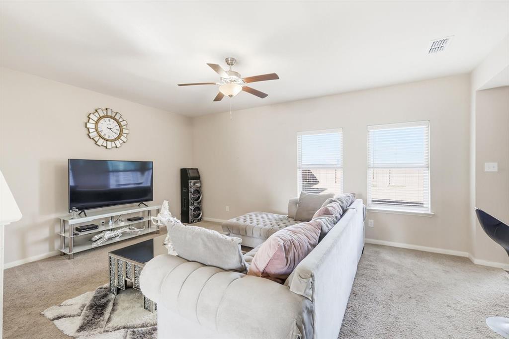 227 Curt Street Anna, TX 75409 - Photo 6 of 40 Carpeted living area with baseboards and ceiling fan