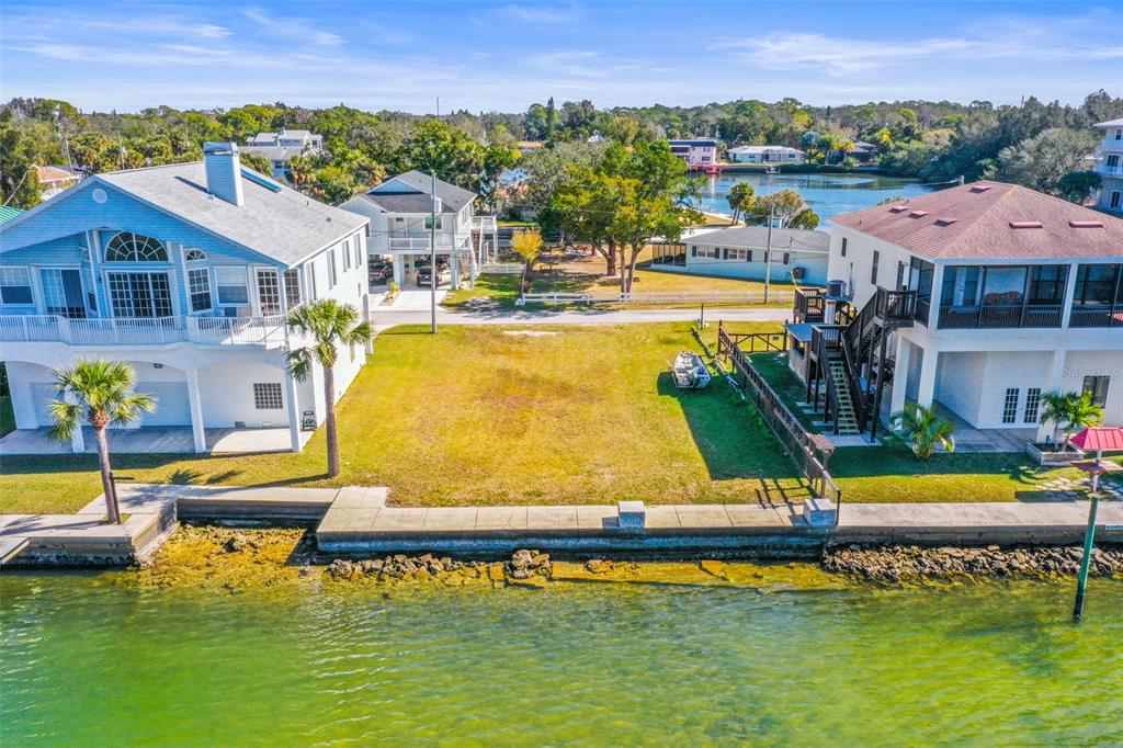 Mcdonald Lane Hudson, FL 34667 - Photo 7 of 17 a view of a swimming pool with a table and chairs