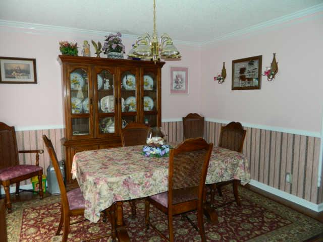 1120 Drake Road Clarksville, TN 37043 - Photo 4 of 17 Formal Dining Room w/ Hardwood Flooring & Crown Molding