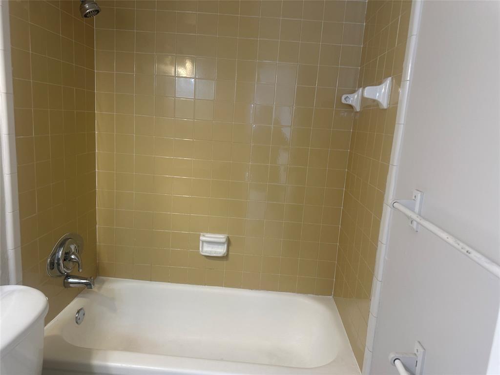 6109 Southwest 30th Street, Unit 4 Miramar, FL 33023 - Photo 14 of 16 a bathroom with a bathtub