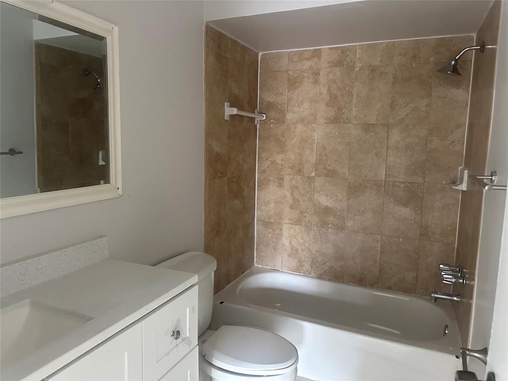 6109 Southwest 30th Street, Unit 4 Miramar, FL 33023 - Photo 15 of 16 a bathroom with a sink a toilet and shower