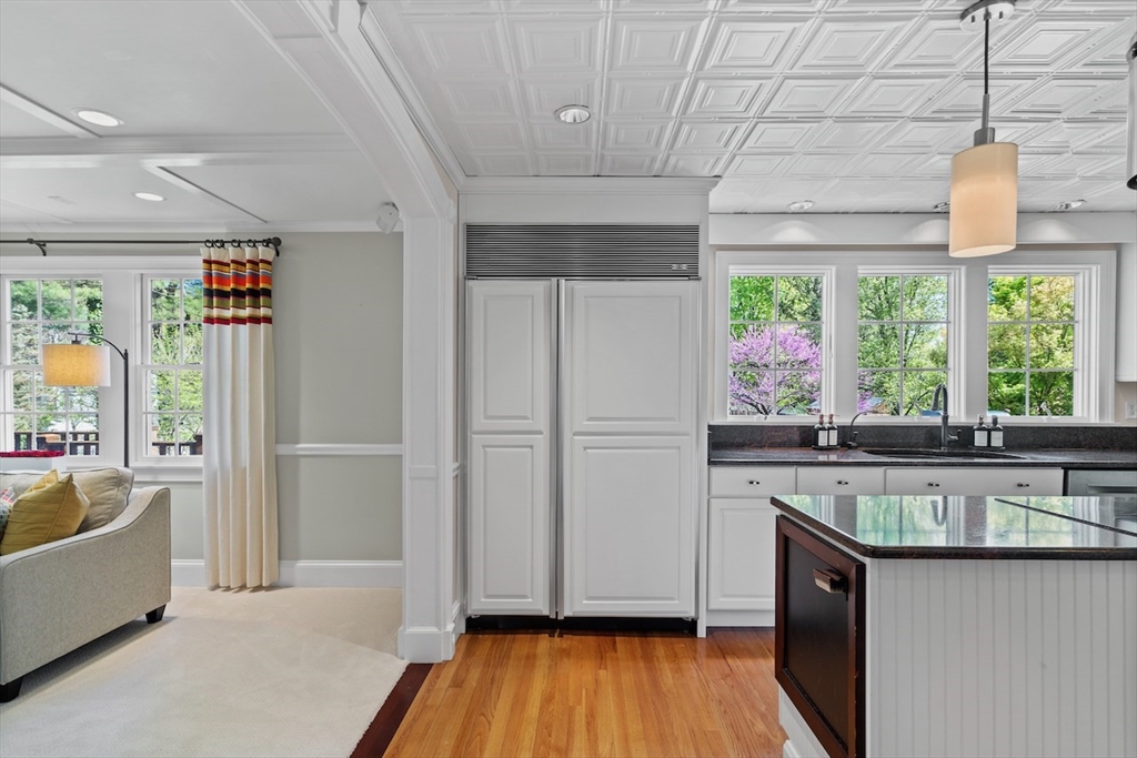 86 Allen Farm Lane Concord, MA 01742 - Photo 12 of 34 a kitchen with stainless steel appliances granite countertop a sink and wooden floors
