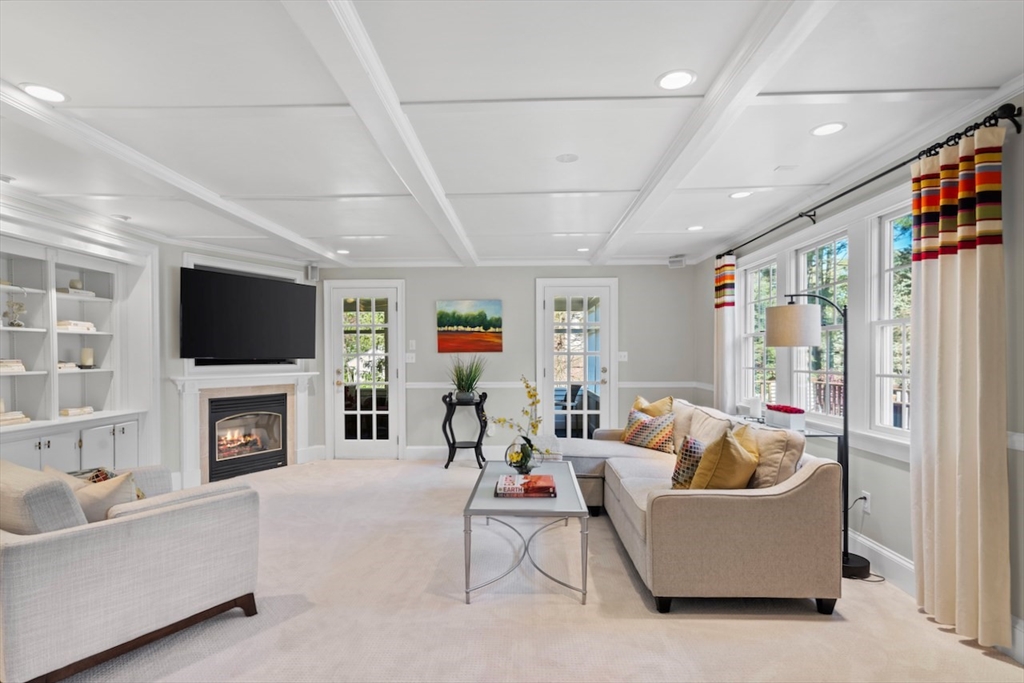86 Allen Farm Lane Concord, MA 01742 - Photo 13 of 34 a living room with furniture and a flat screen tv