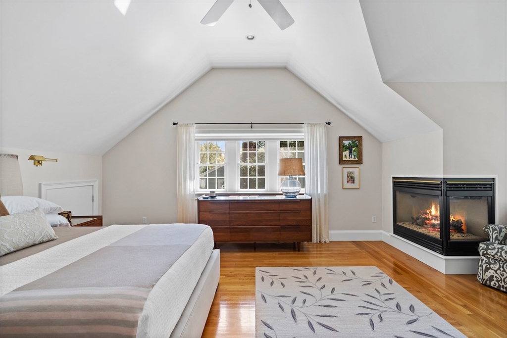 86 Allen Farm Lane Concord, MA 01742 - Photo 16 of 34 a large bedroom with a bed and wooden floor