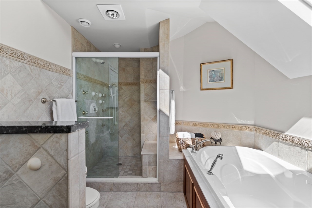 86 Allen Farm Lane Concord, MA 01742 - Photo 19 of 34 a bathroom with a bathtub and shower