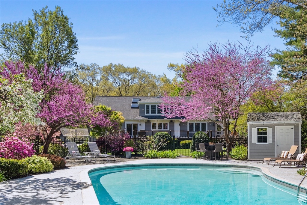 86 Allen Farm Lane Concord, MA 01742 - Photo 2 of 34 a view of a house with a swimming pool