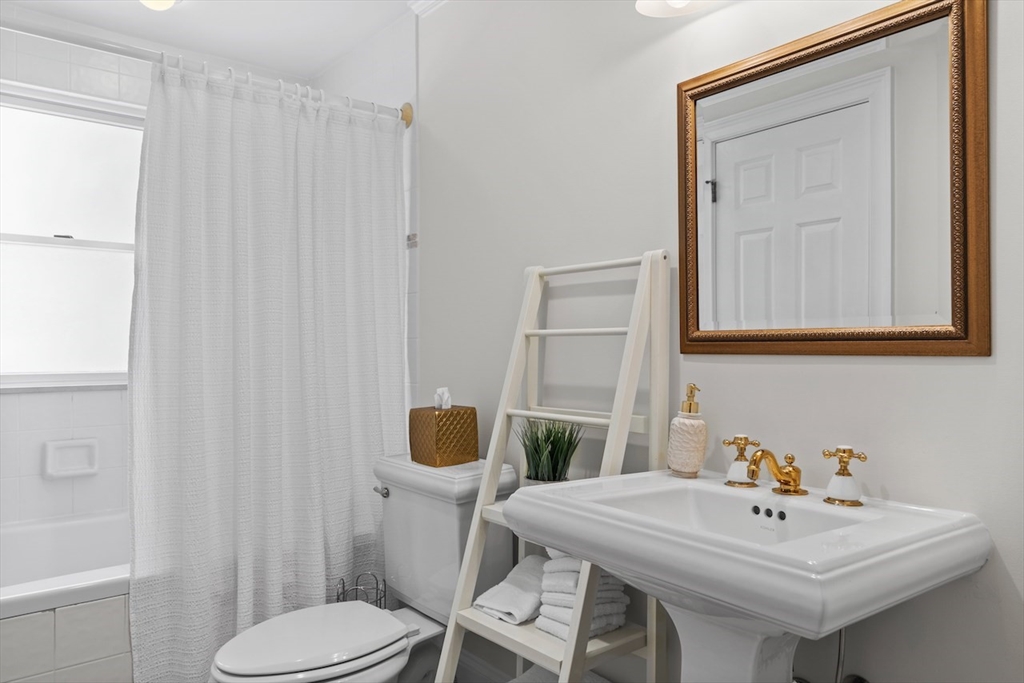 86 Allen Farm Lane Concord, MA 01742 - Photo 24 of 34 a bathroom with a sink a toilet and mirror