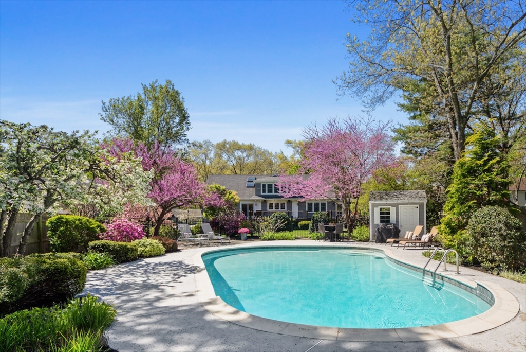 86 Allen Farm Lane Concord, MA 01742 - Photo 30 of 34 a view of a house with swimming pool and a chairs