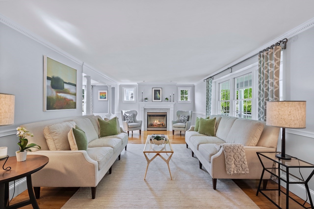 86 Allen Farm Lane Concord, MA 01742 - Photo 4 of 34 a living room with furniture and a fireplace
