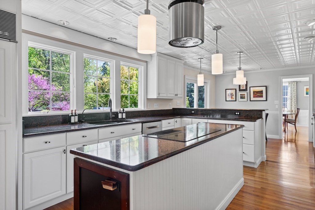 86 Allen Farm Lane Concord, MA 01742 - Photo 9 of 34 a kitchen with a sink a counter top space and a large window