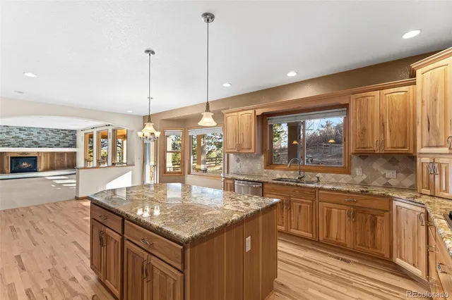 a room with pool table and windows