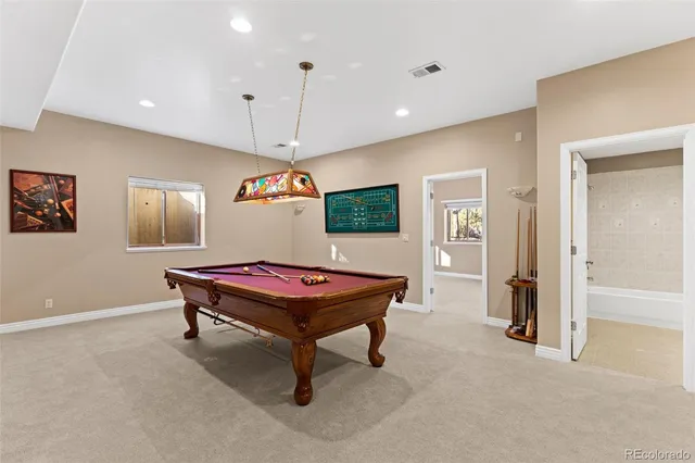 a large spacious bathroom with a large tub and shower