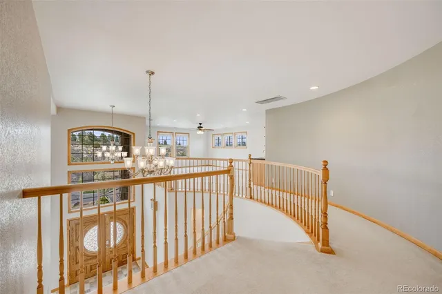 a view of balcony with wooden floor