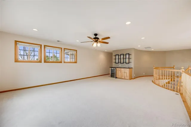 a view of balcony with wooden floor and fence
