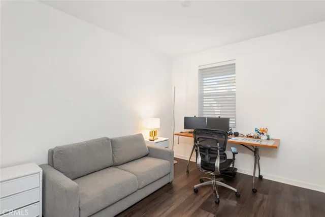 a work room with furniture and windows