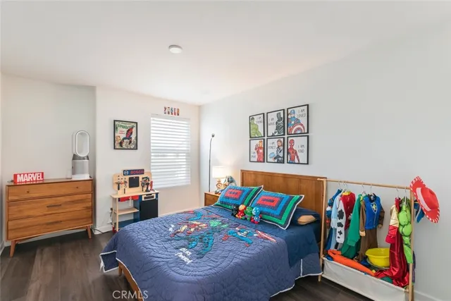 a bed room with furniture and a table