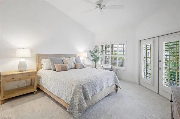 a bed room with a bed and a night stand