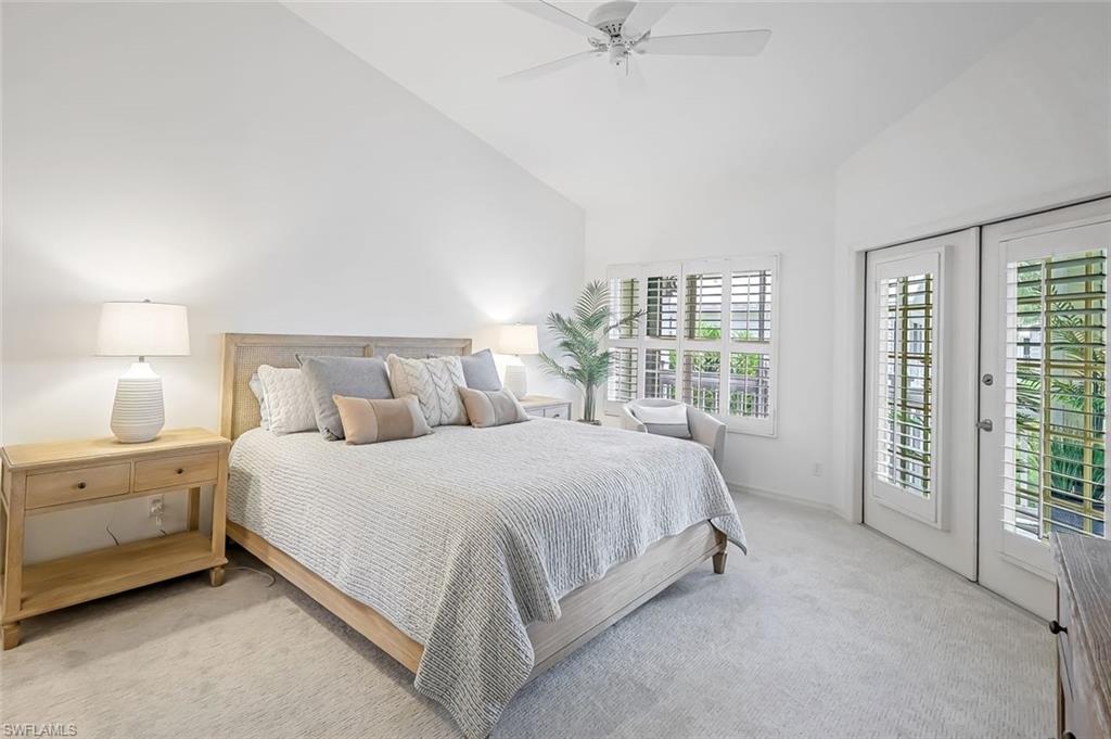 433 2nd Street South, Unit B202 Naples, FL 34102 - Photo 19 of 31 a bed room with a bed and a night stand