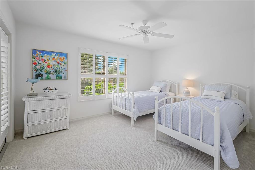 433 2nd Street South, Unit B202 Naples, FL 34102 - Photo 25 of 31 a spacious bedroom with two bed and a window