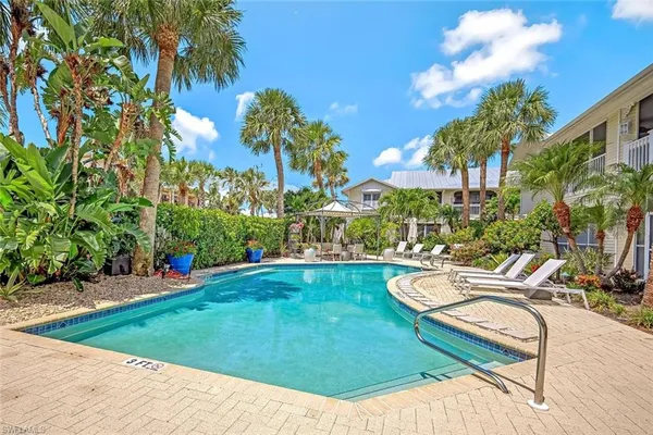 a view of a swimming pool with a lounge chairs