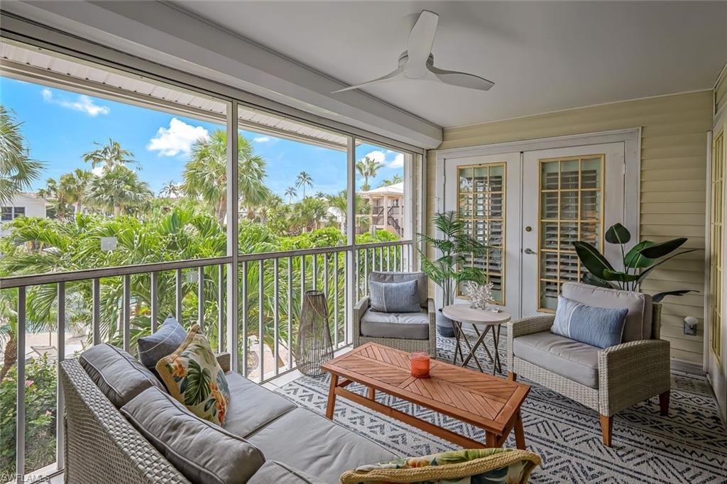 433 2nd Street South, Unit B202 Naples, FL 34102 - Photo 10 of 31 a living room with furniture and a large window