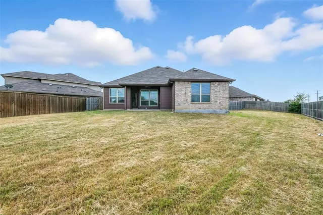 a house with swimming pool in front of it