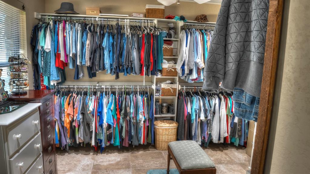 187 Roy Chisum Road Leakey, TX 78873 - Photo 28 of 40 a view of walk in closet with clothes