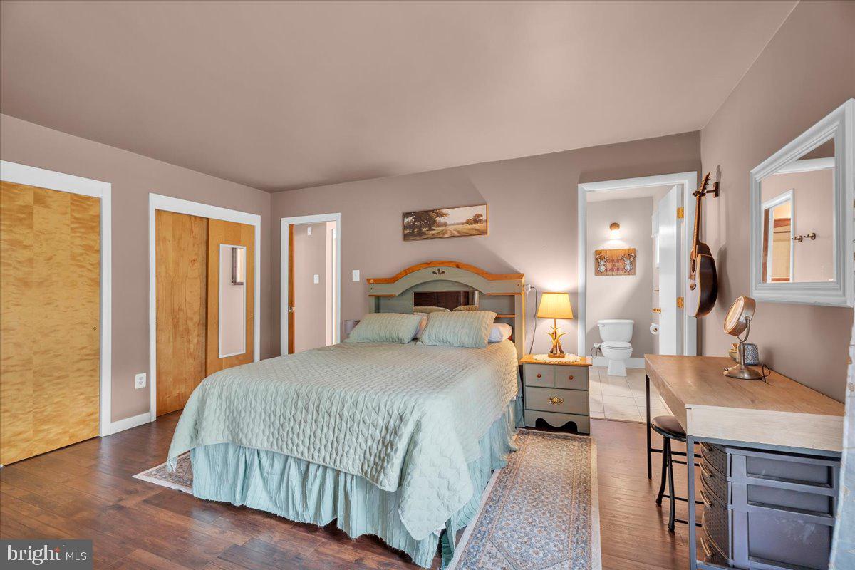 64 Blue Anchor Road Sicklerville, NJ 08081 - Photo 16 of 47 a bedroom with a bed and a table