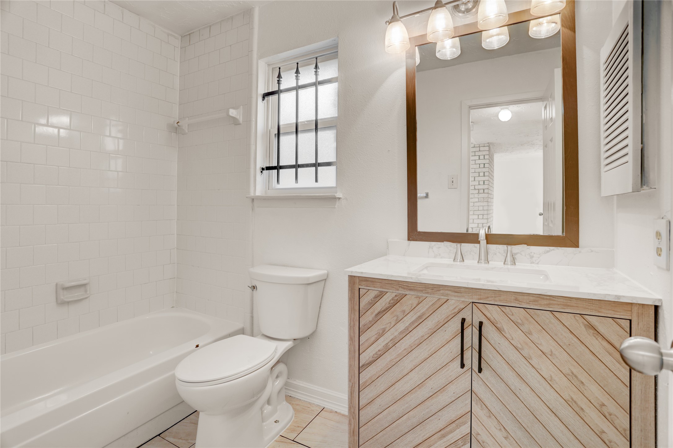 5437 Ridge Wind Lane Houston, TX 77053 - Photo 11 of 12 a bathroom with a sink a toilet and shower