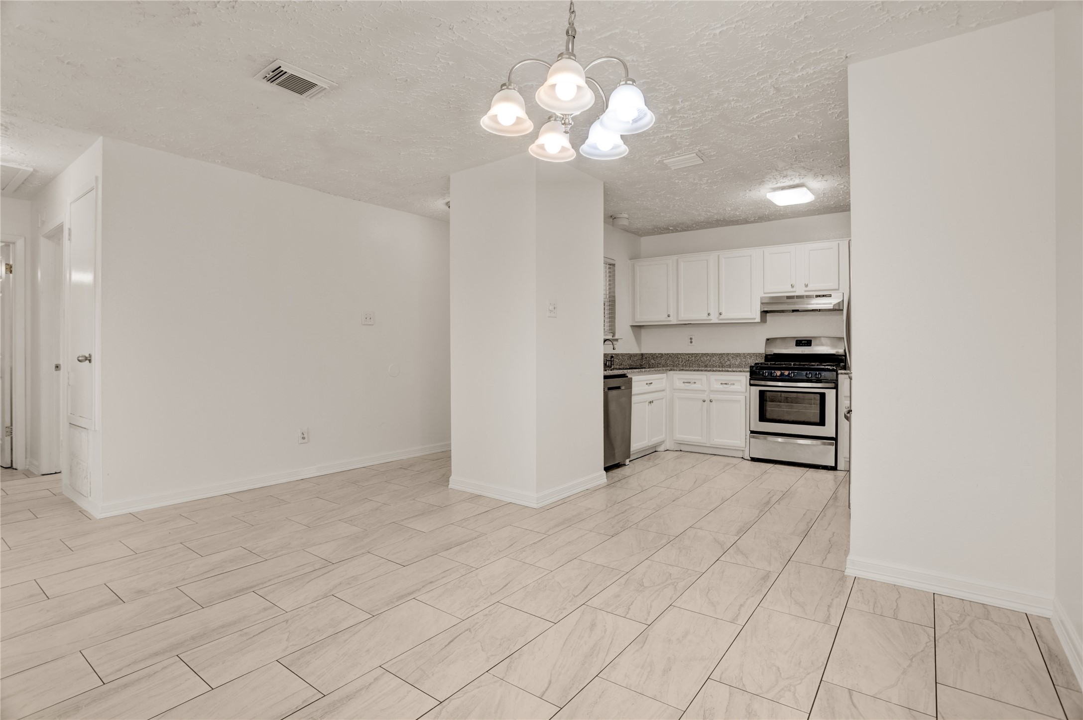 5437 Ridge Wind Lane Houston, TX 77053 - Photo 3 of 12 a view of kitchen with a sink cabinets and stainless steel appliances