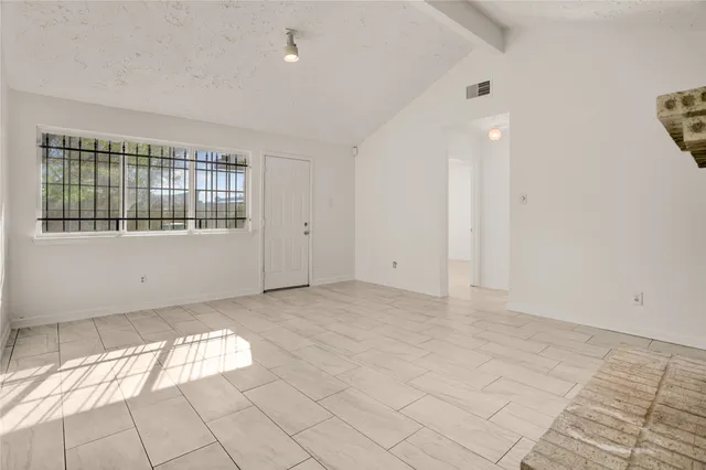 an empty room with windows