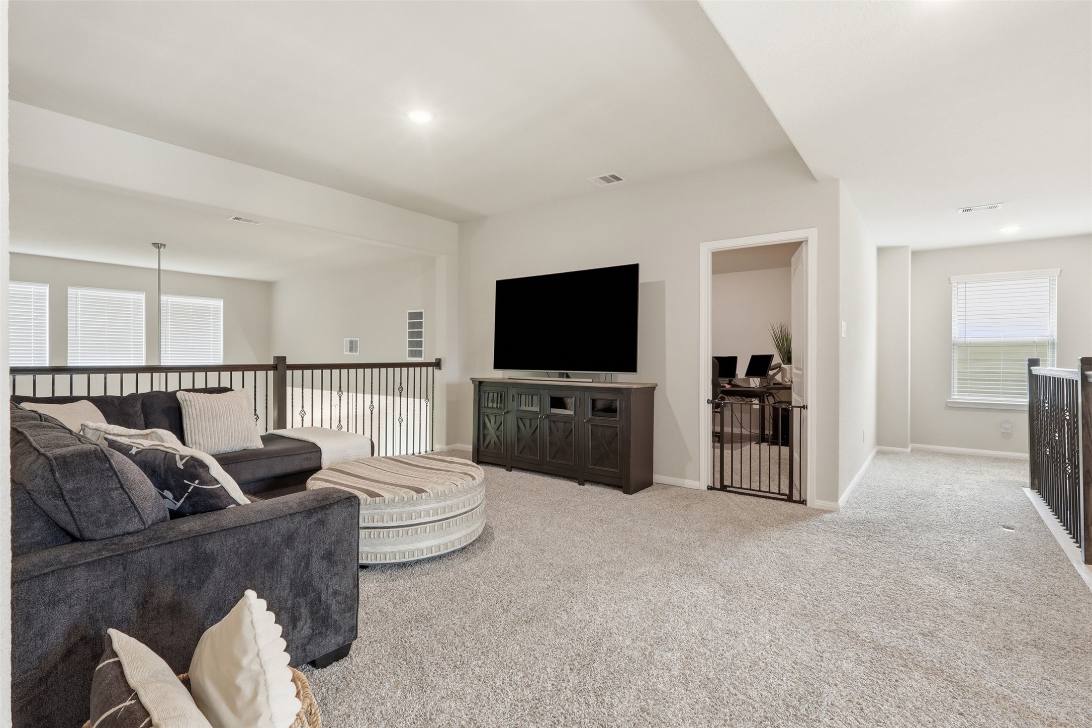 6310 Fawn Path Drive Conroe, TX 77303 - Photo 23 of 41 Centrally located game room adjacent to the media room and upstairs bedrooms, creating the perfect space for entertainment and family gatherings.