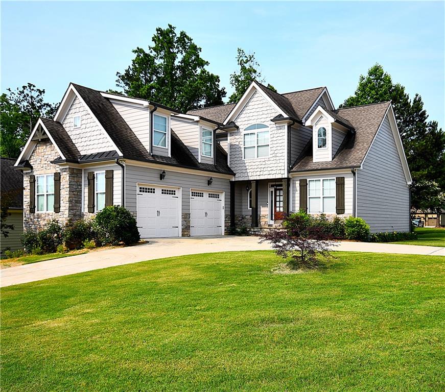50 Worthington Lane Villa Rica, GA 30180 - Photo 1 of 1 a front view of a house with a yard and garage