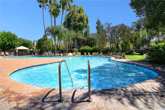 a view of a swimming pool with a patio