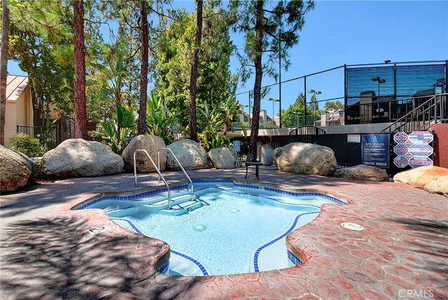 a view of a swimming pool with a patio