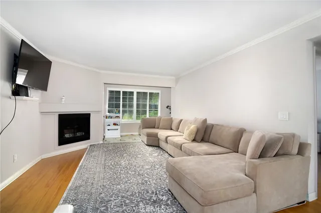 a living room with furniture window and a flat screen tv