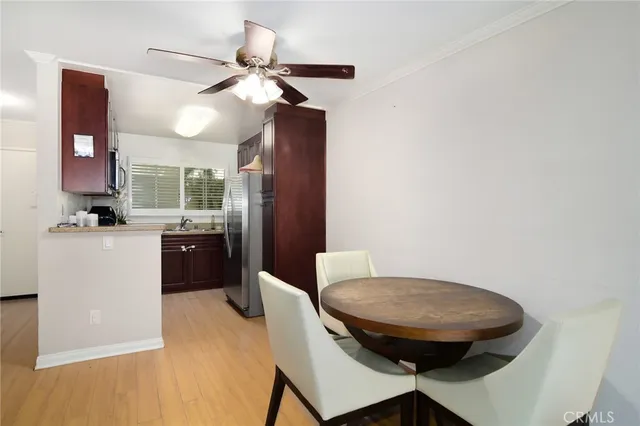 a view of a room with a table and chairs