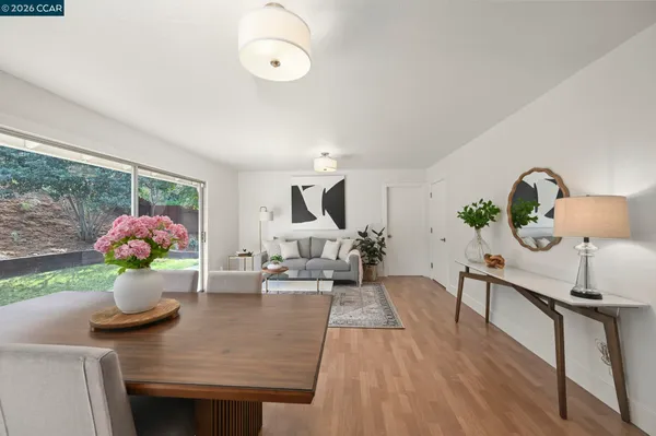 a living room with furniture and flowers