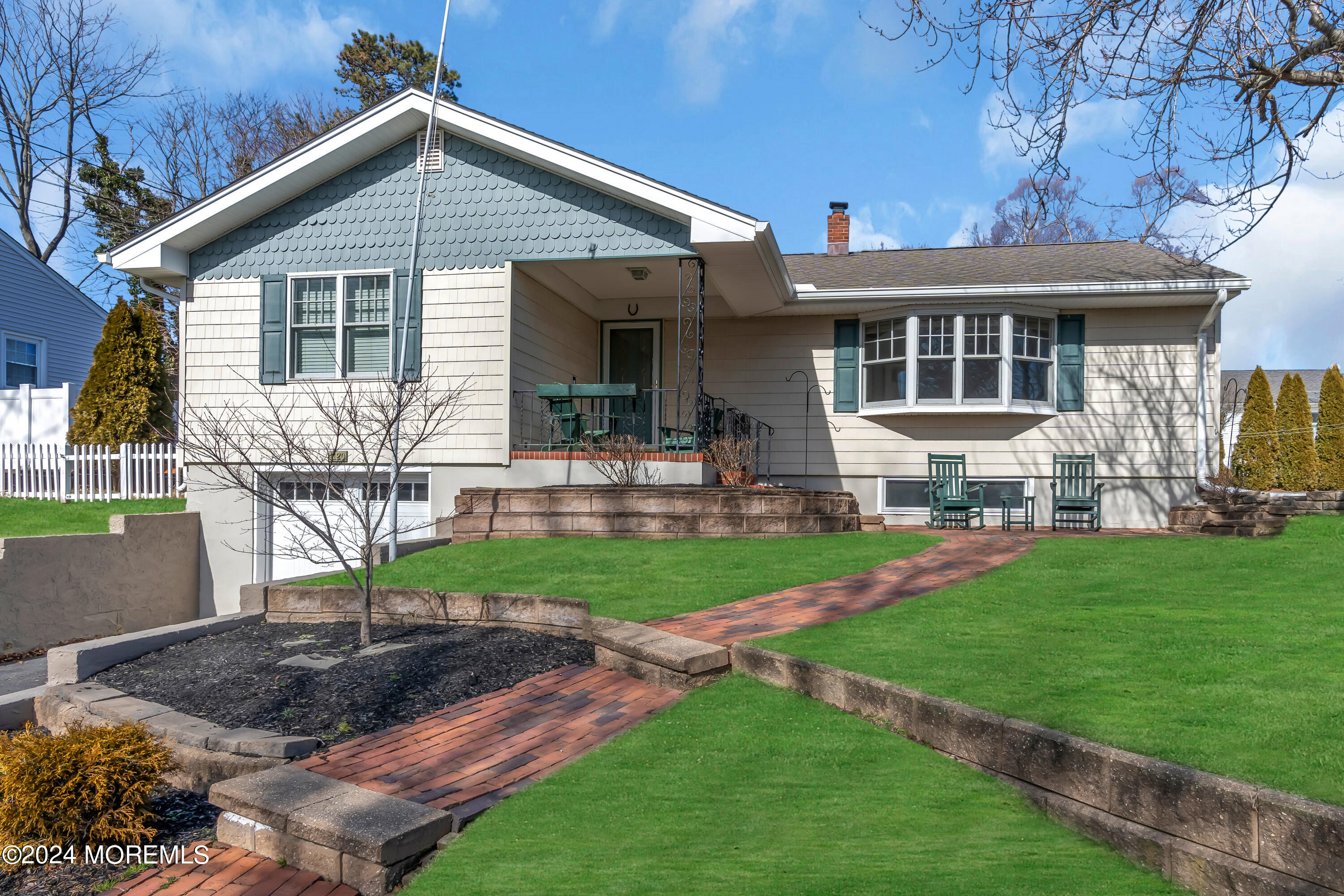 1120 Mohegan Road Manasquan, NJ 08736 - Photo 1 of 38 a front view of house with yard