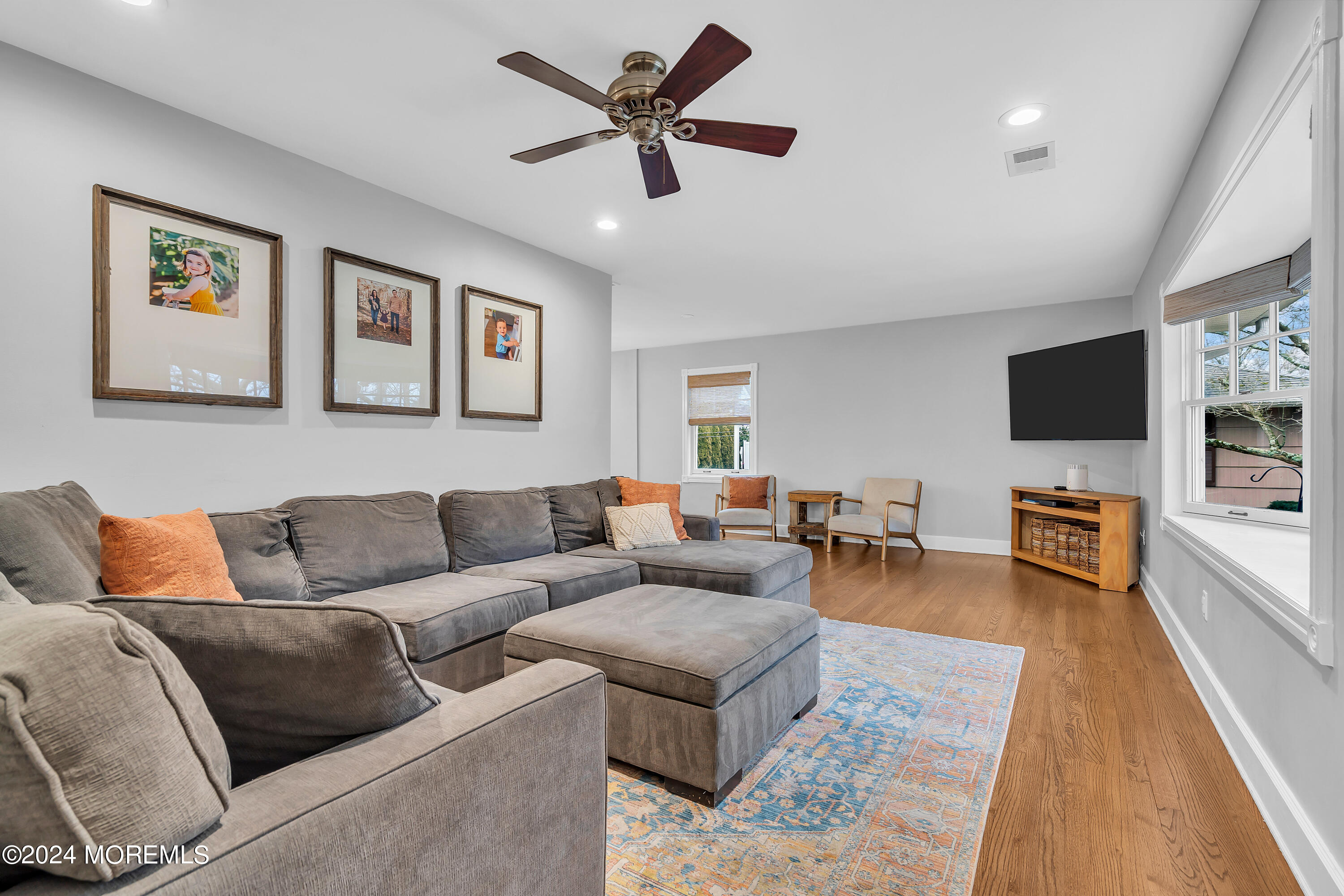 1120 Mohegan Road Manasquan, NJ 08736 - Photo 8 of 38 a living room with furniture and a flat screen tv