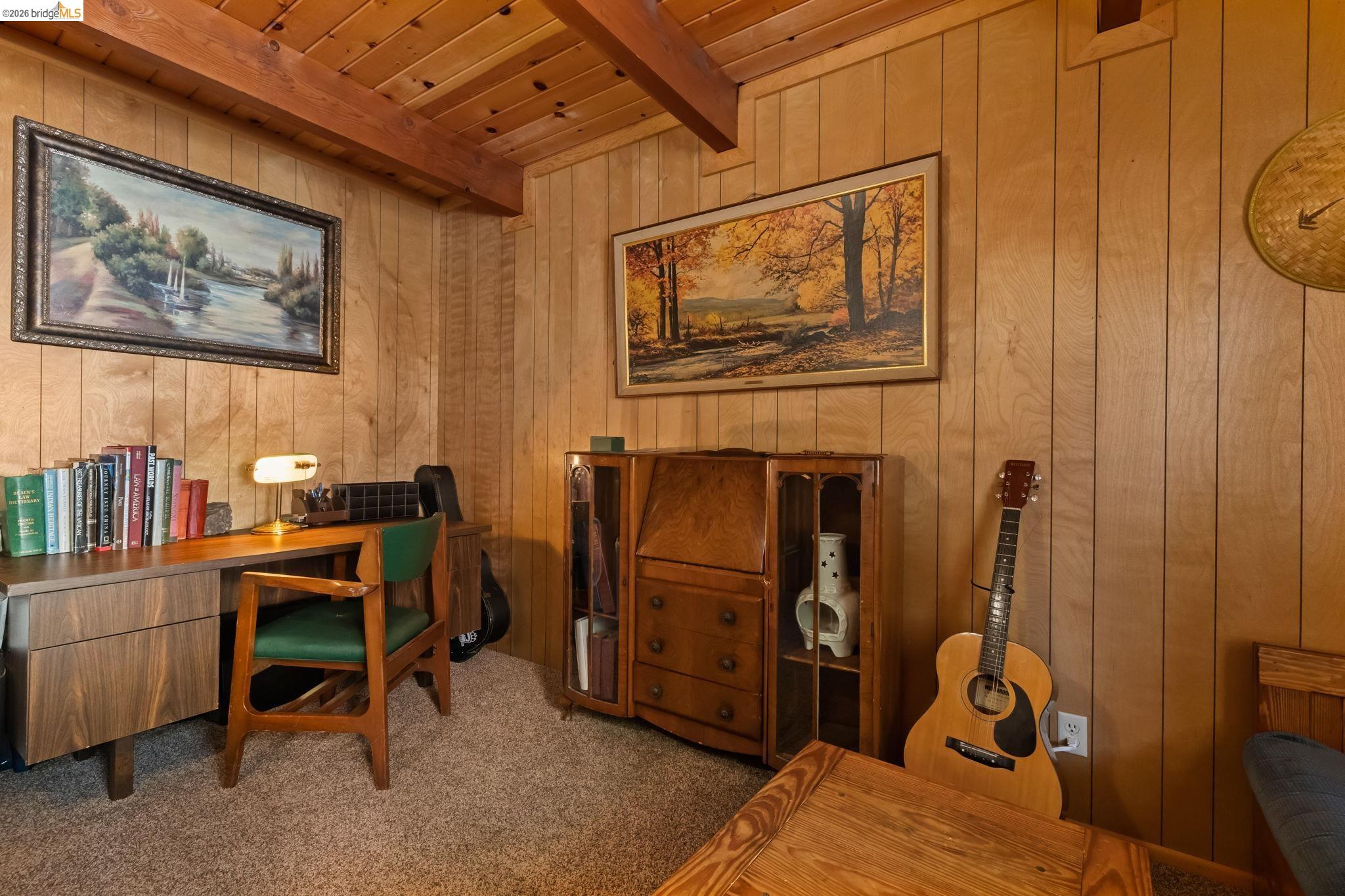 26039 Long Barn Road Long Barn, CA 95335 - Photo 6 of 27 Home office featuring wooden walls, a wooden ceiling with exposed beams, and carpet flooring